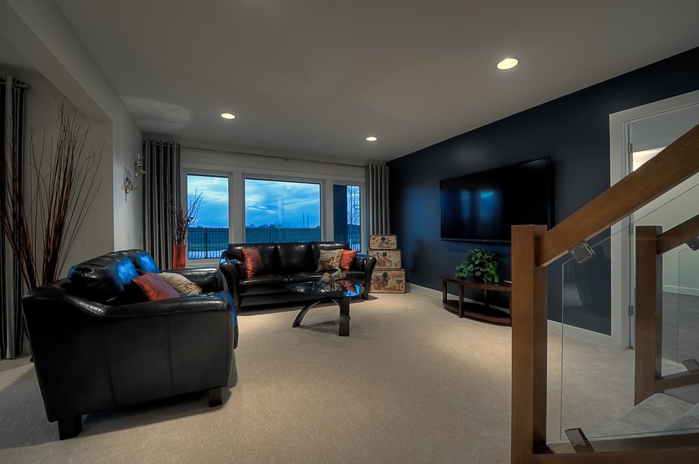 Mid-sized transitional open concept family room in Other with a home bar, blue walls, carpet and a wall-mounted tv.