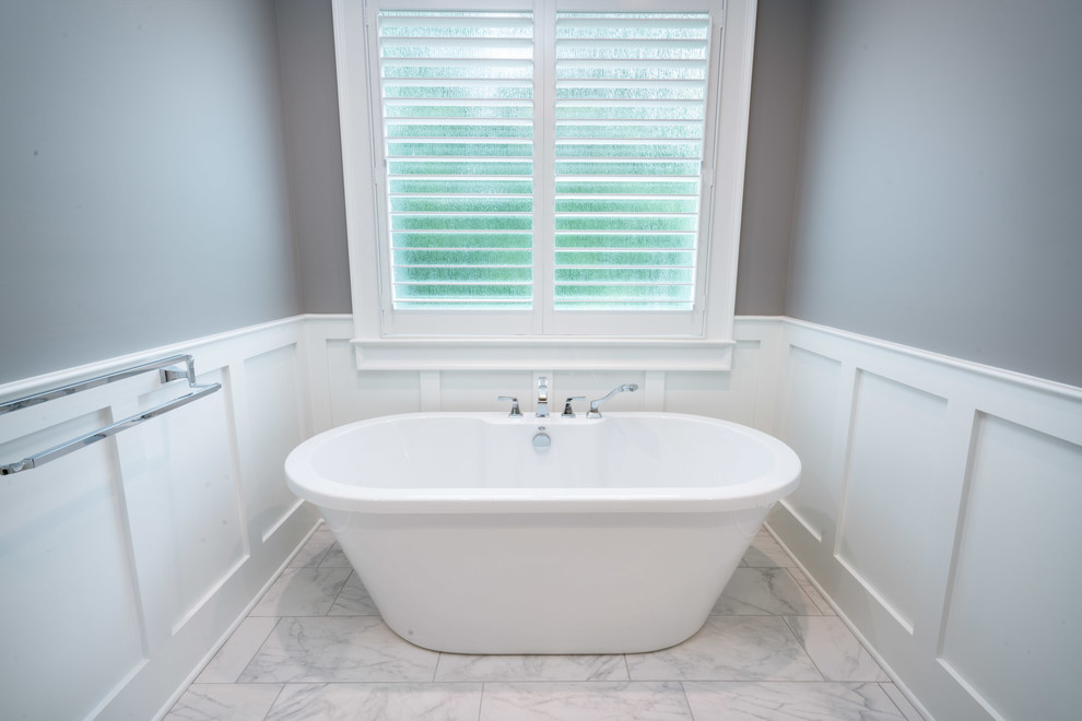 Inspiration for a large transitional master bathroom in Other with shaker cabinets, white cabinets, a freestanding tub, an alcove shower, a two-piece toilet, gray tile, marble, grey walls, marble floors, an undermount sink, marble benchtops, grey floor and an open shower.