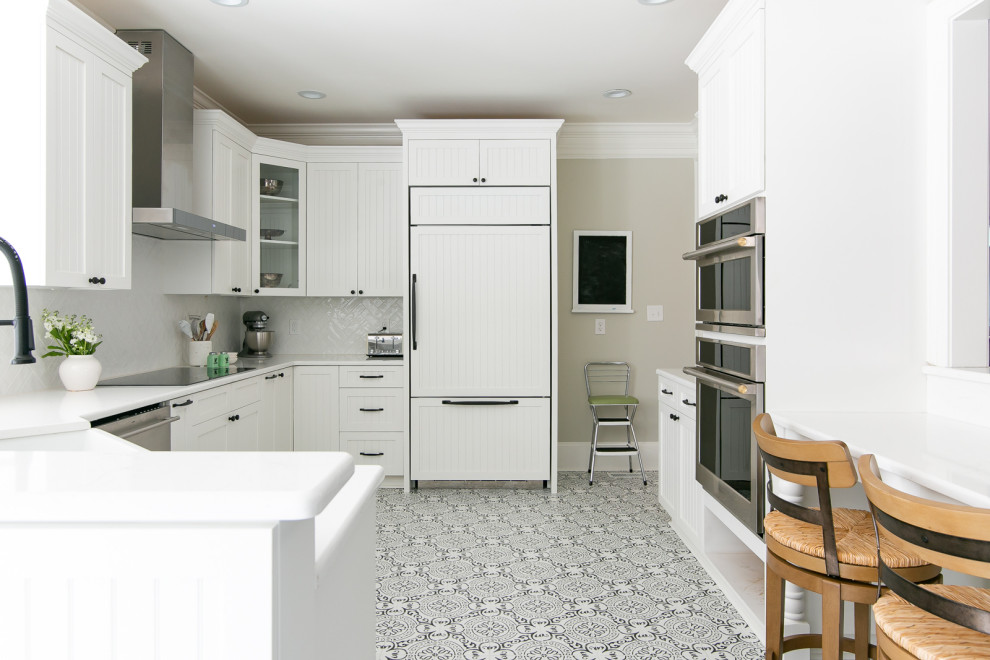Open concept kitchen - large transitional porcelain tile and white floor open concept kitchen idea with a farmhouse sink, beaded inset cabinets, white cabinets, quartzite countertops, white backsplash, porcelain backsplash, stainless steel appliances and white countertops