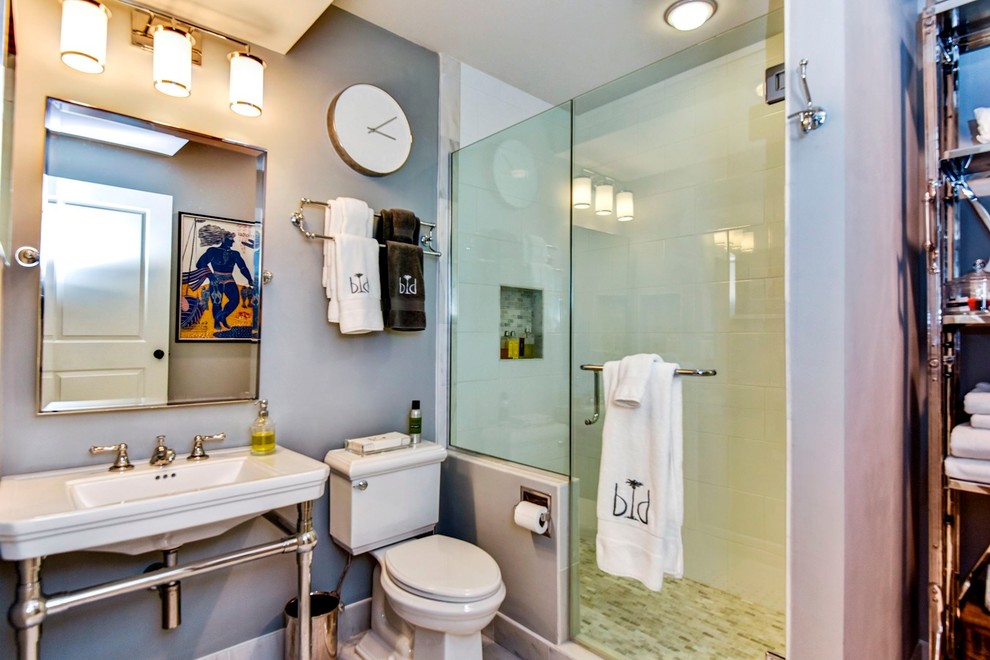 Design ideas for a mid-sized mediterranean bathroom in DC Metro with flat-panel cabinets, medium wood cabinets, a drop-in tub, an alcove shower, a two-piece toilet, white tile, marble, grey walls, mosaic tile floors, an undermount sink, marble benchtops, multi-coloured floor and a hinged shower door.