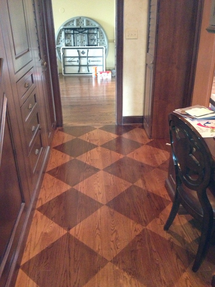Mid-sized transitional medium tone wood floor hallway photo in Philadelphia with beige walls