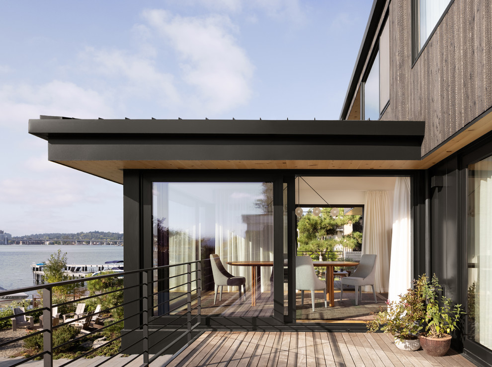 Contemporary metal railing balcony in Seattle with no cover.