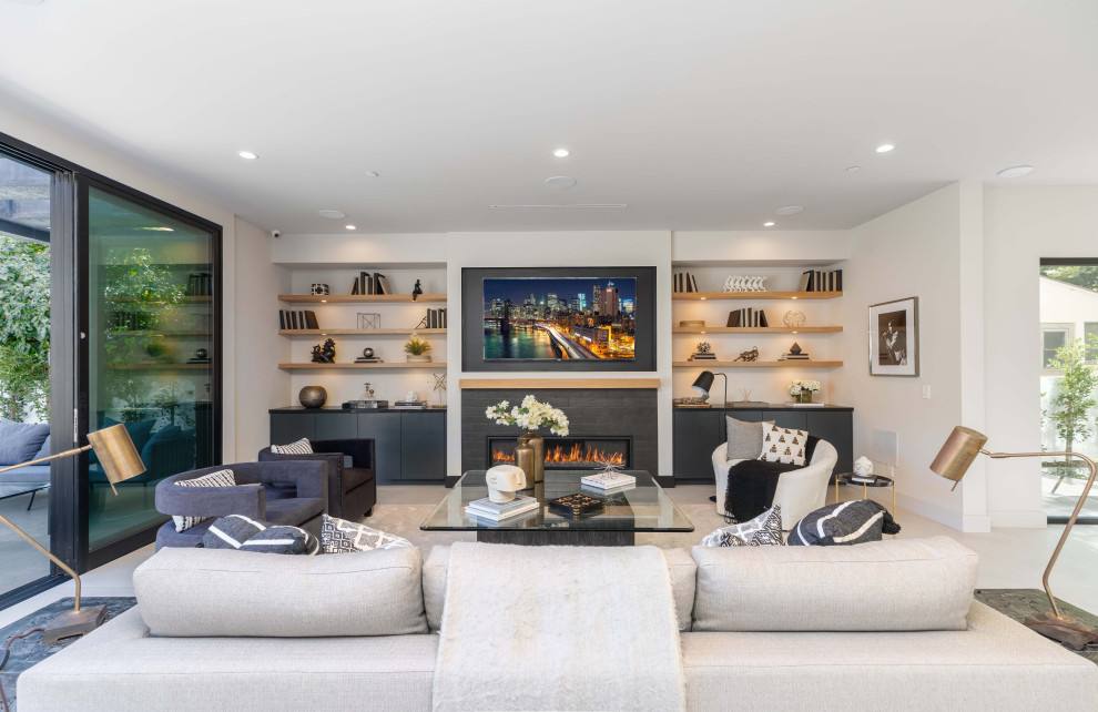 Large contemporary open concept living room in Los Angeles with white walls, porcelain floors, a ribbon fireplace, a tile fireplace surround, a wall-mounted tv and grey floor.