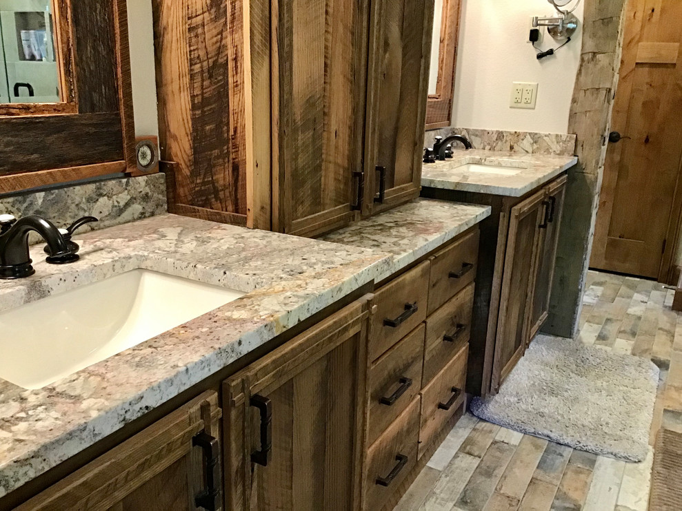 Example of a mid-sized mountain style master bathroom design with brown cabinets, granite countertops and brown countertops