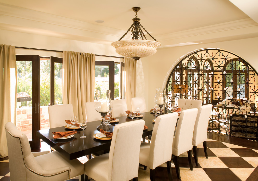 Inspiration for a mediterranean dining room in Los Angeles with beige walls.