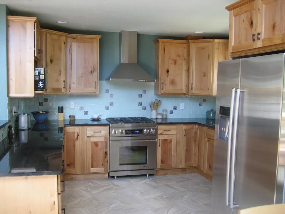 Mid-sized transitional u-shaped ceramic tile and beige floor enclosed kitchen photo in Denver with recessed-panel cabinets, light wood cabinets, blue backsplash, stainless steel appliances, an island, an undermount sink, granite countertops and ceramic backsplash