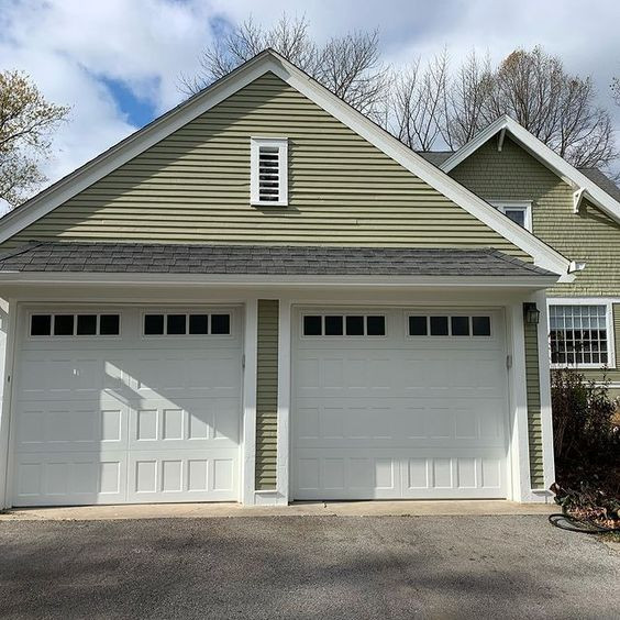 Inspiration for a medium sized classic attached double garage in St Louis.