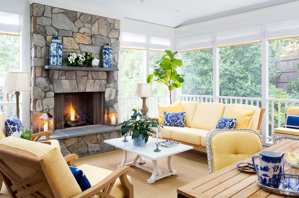 Inspiration for a transitional sunroom in DC Metro with carpet, a standard fireplace, a stone fireplace surround and a standard ceiling.