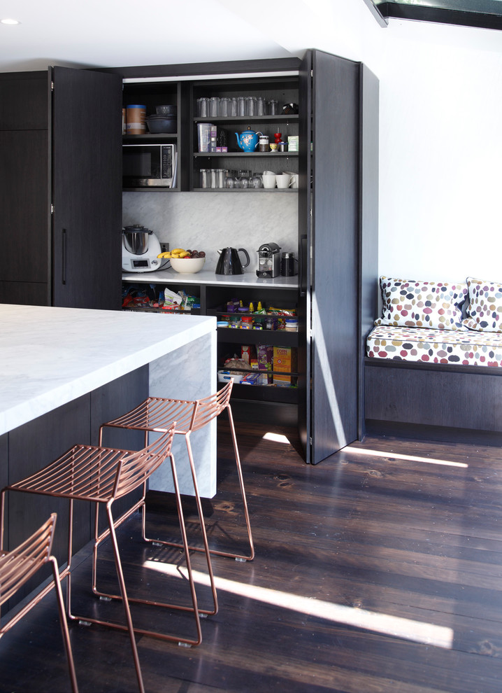 Inspiration for a large contemporary galley kitchen pantry in Sydney with an undermount sink, flat-panel cabinets, black cabinets, marble benchtops, white splashback, stone slab splashback, stainless steel appliances, painted wood floors and a peninsula.