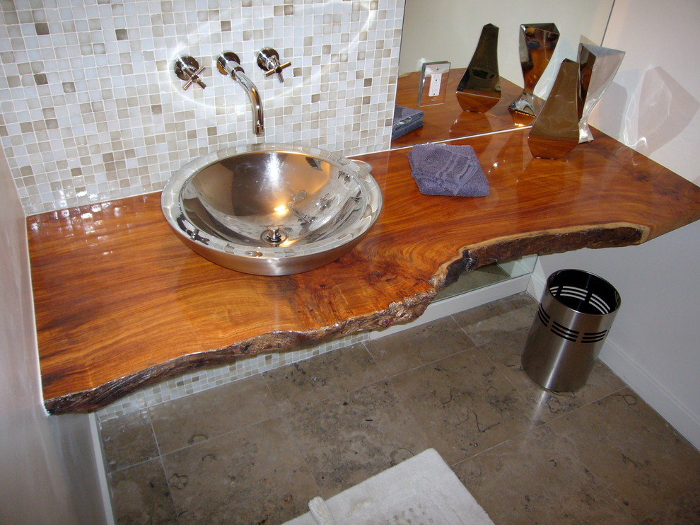 This is an example of a mid-sized modern 3/4 bathroom in Other with a vessel sink, wood benchtops, glass tile, white walls, travertine floors, beige tile and white tile.