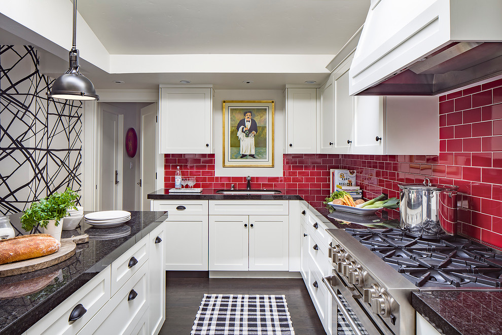 Inspiration for a transitional kitchen in San Francisco with a single-bowl sink, shaker cabinets, white cabinets, red splashback, subway tile splashback, stainless steel appliances, dark hardwood floors and with island.