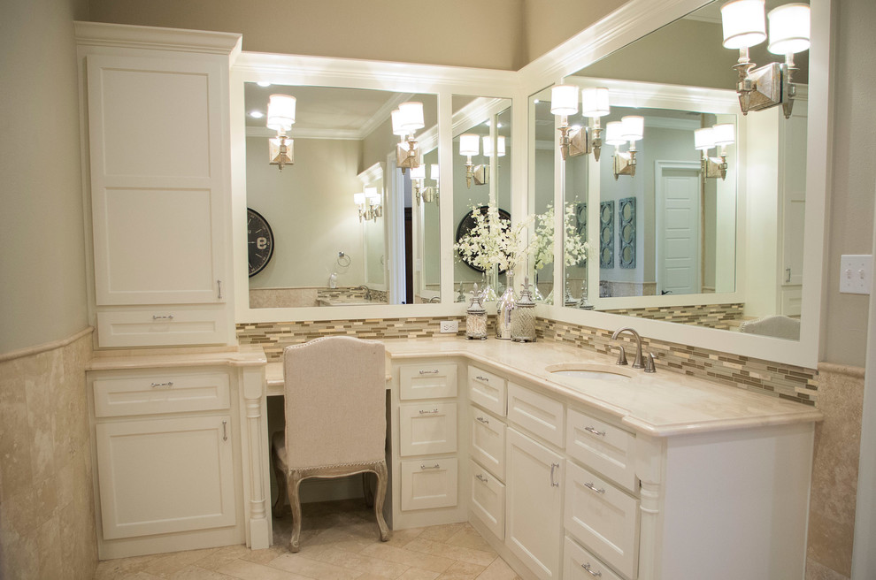 Bathroom - transitional ceramic tile travertine floor bathroom idea in Austin with an undermount sink and marble countertops