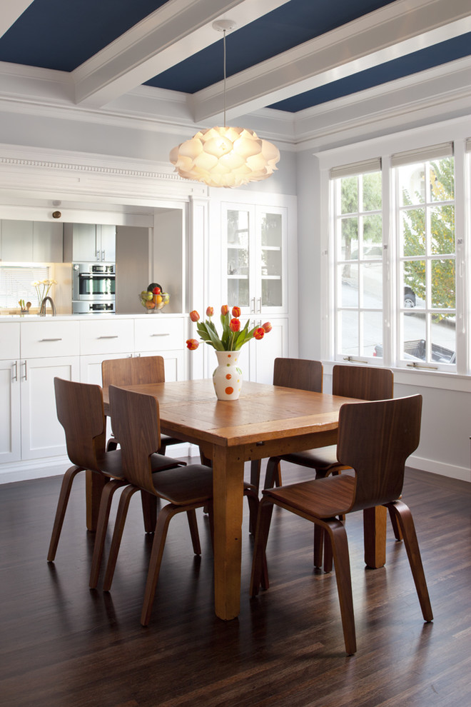 Photo of a traditional eat-in kitchen in San Francisco with recessed-panel cabinets and white cabinets.