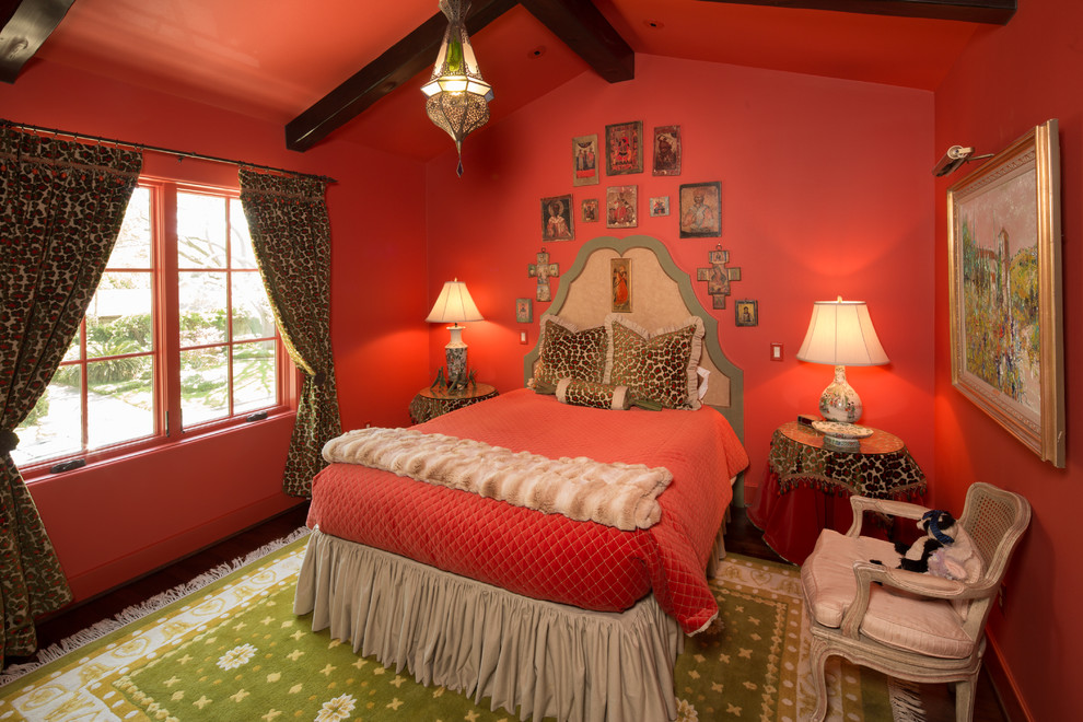 Mid-sized mediterranean guest bedroom in Houston with red walls and no fireplace.