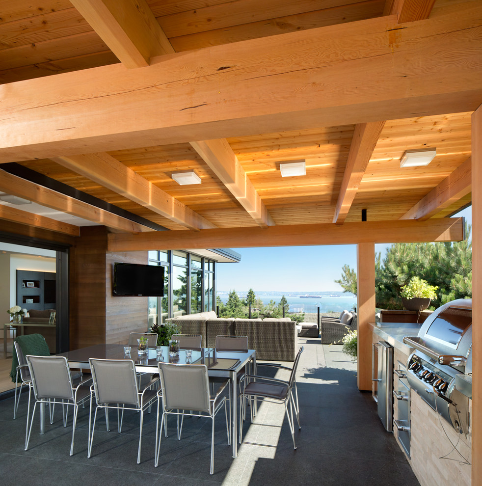 This is an example of an expansive contemporary deck in Vancouver.