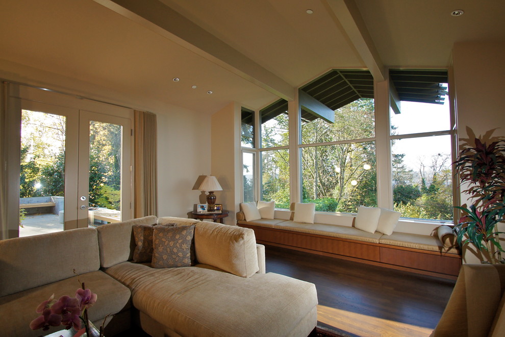 Photo of a contemporary living room in Seattle with beige walls and dark hardwood floors.