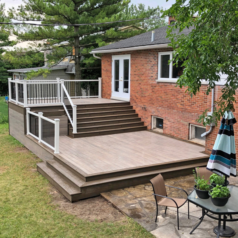 Large modern backyard deck in Montreal.