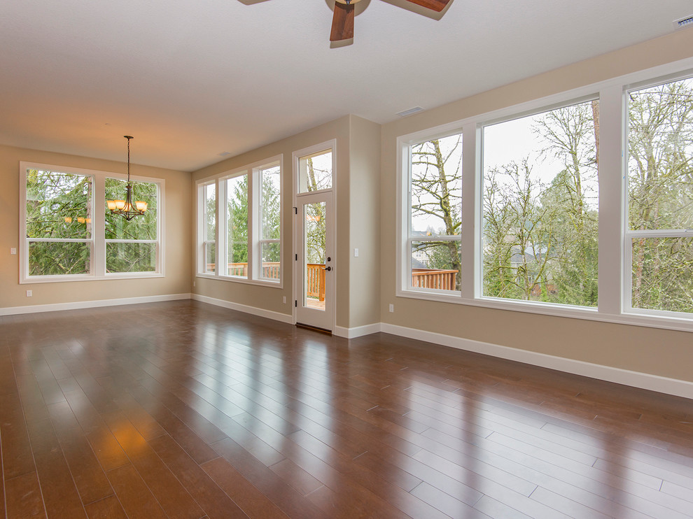 Photo of a large transitional open plan dining in Portland with medium hardwood floors.