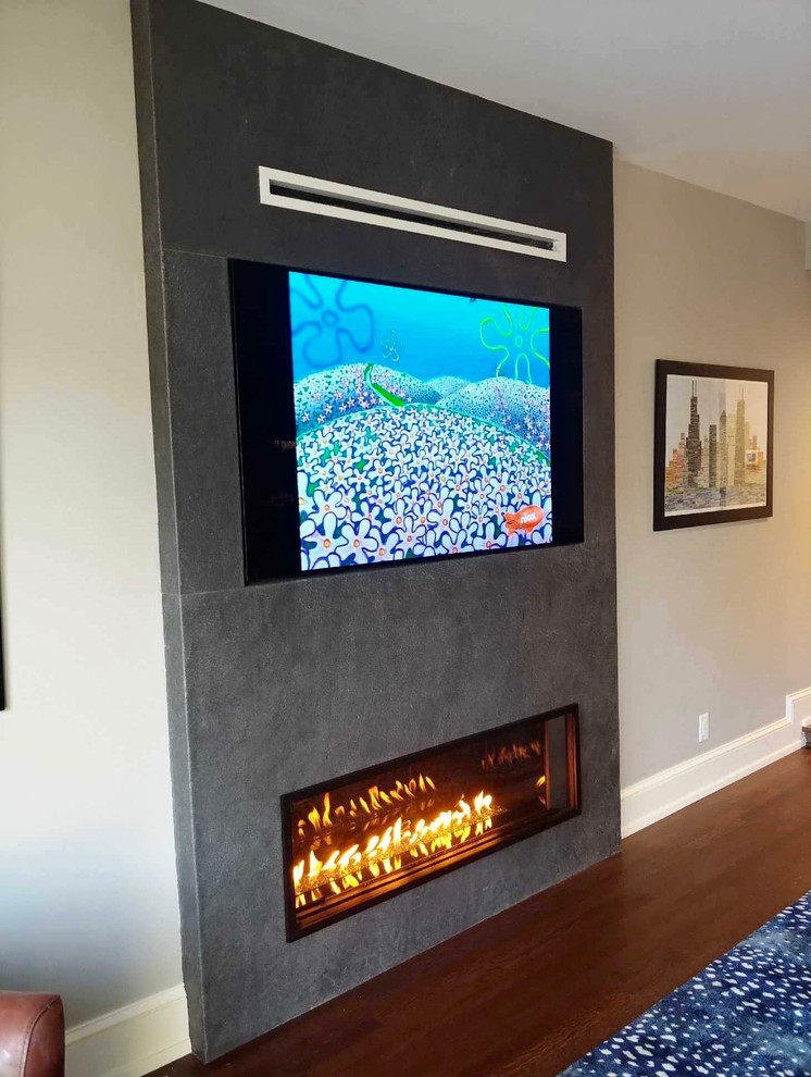 Inspiration for a transitional family room remodel in Milwaukee with a standard fireplace and a stone fireplace