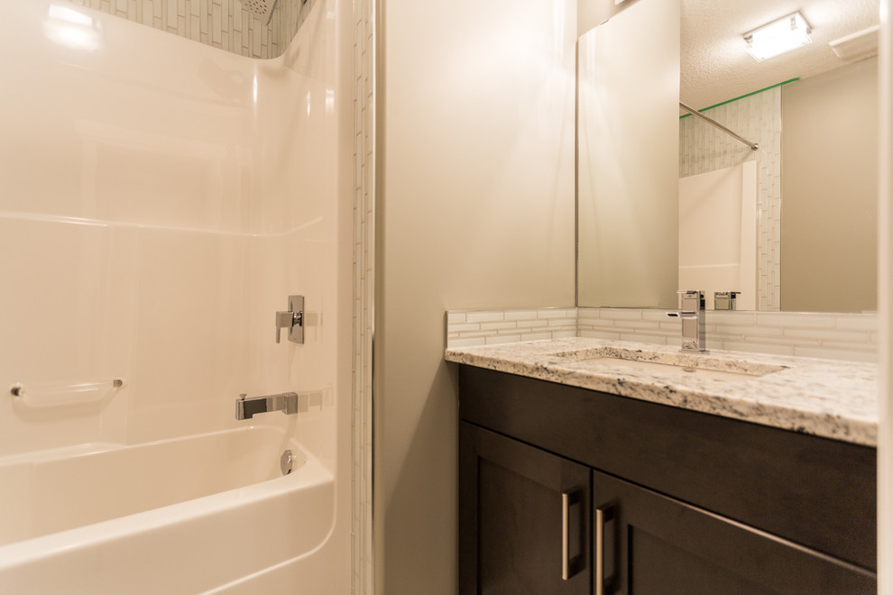 Example of a transitional home design design in Edmonton
