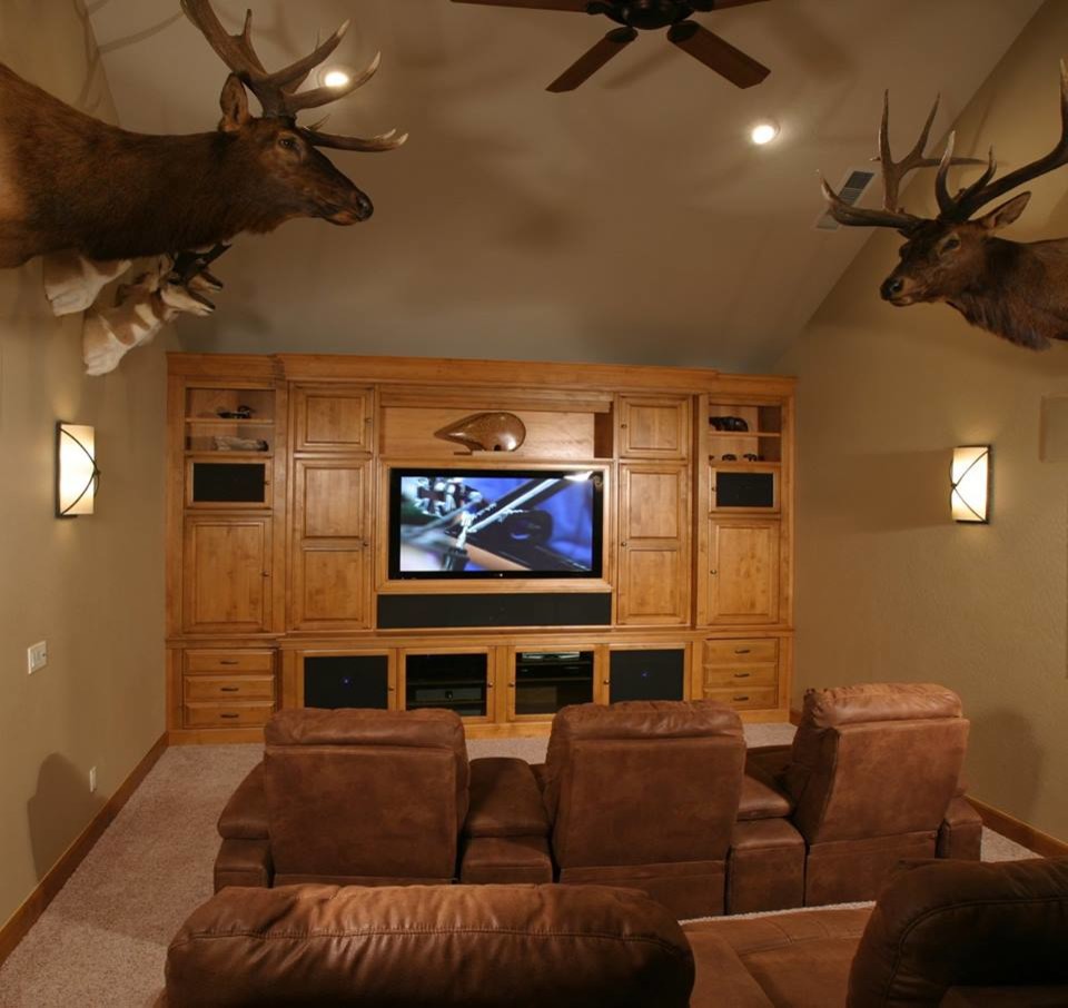 This is an example of a large transitional open concept home theatre in Phoenix with beige walls, ceramic floors, a built-in media wall and beige floor.