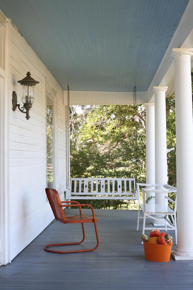 Design ideas for a traditional verandah in New York with decking and a roof extension.