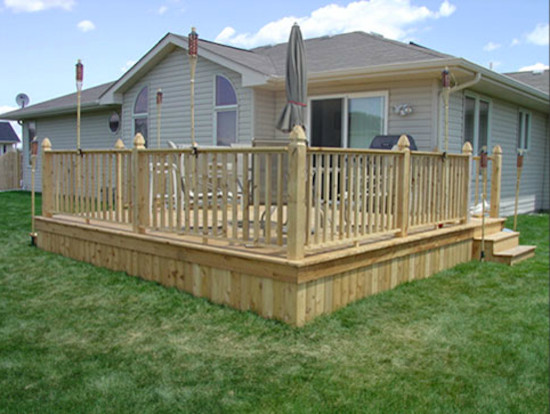 Inspiration for a mid-sized backyard deck remodel with a fire pit and no cover