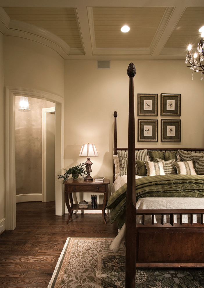 Photo of a large country master bedroom in Charlotte with beige walls, dark hardwood floors and no fireplace.