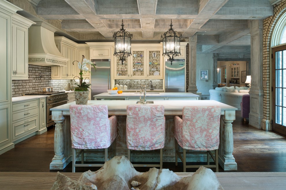 Example of a large transitional l-shaped open concept kitchen design in Atlanta with beaded inset cabinets and two islands