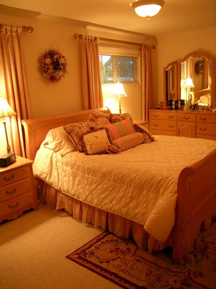Design ideas for a mid-sized traditional master bedroom in San Francisco with beige walls and carpet.
