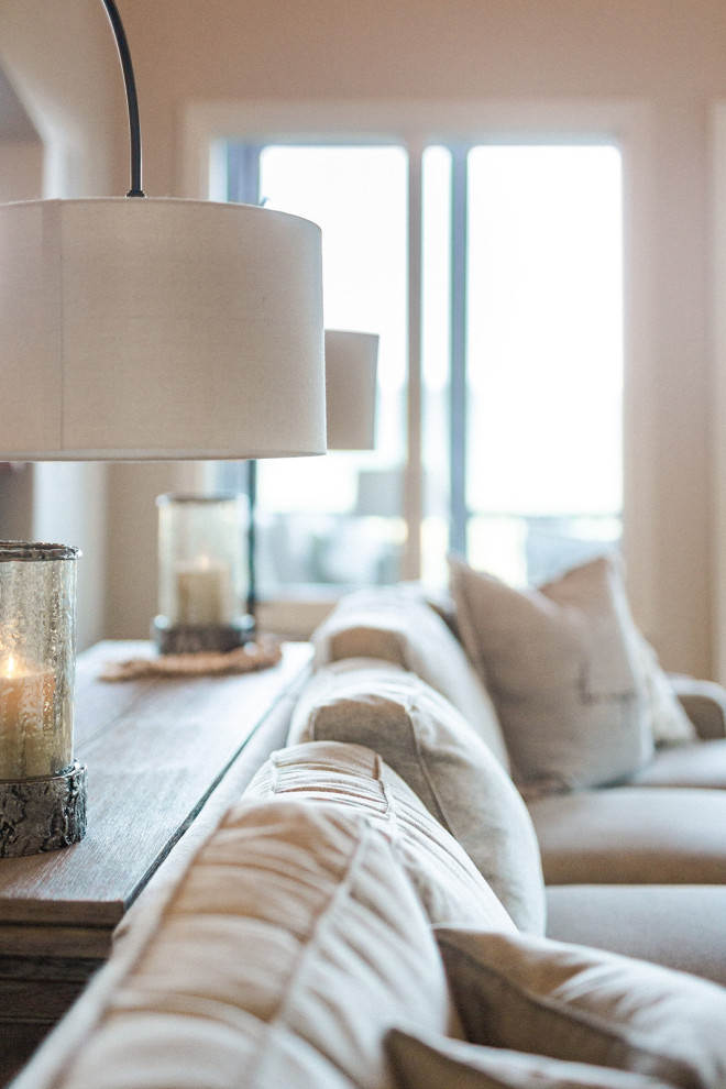 Example of a huge country open concept medium tone wood floor family room design in Birmingham with a standard fireplace and a stone fireplace