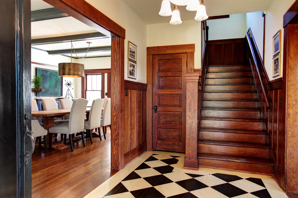Inspiration for a mid-sized country foyer in Los Angeles with painted wood floors.