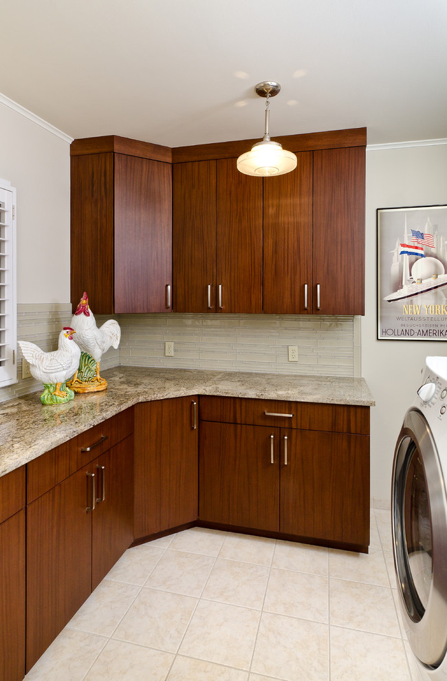 This is an example of a traditional laundry room in Other with flat-panel cabinets and dark wood cabinets.