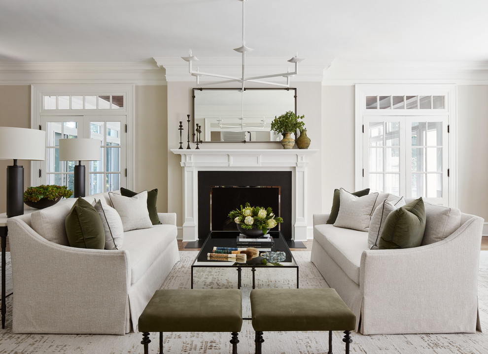 This is an example of a mid-sized transitional formal enclosed living room in Chicago with grey walls, a standard fireplace, medium hardwood floors, no tv and brown floor.