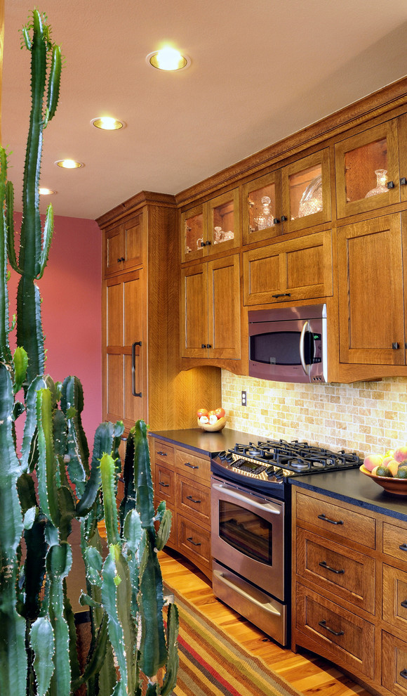 Inspiration for a craftsman galley eat-in kitchen remodel in Denver with an island