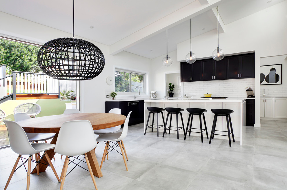 Photo of a scandinavian kitchen/dining combo in Sydney with white walls.