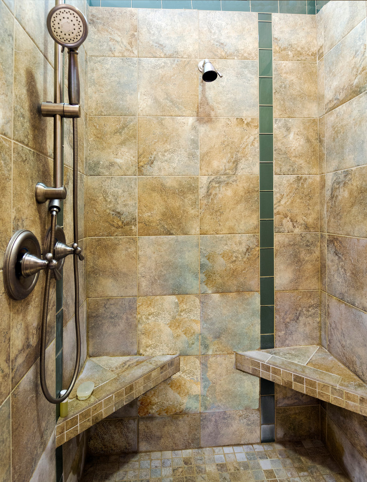 Large transitional master brown tile and stone tile marble floor bathroom photo with beige walls