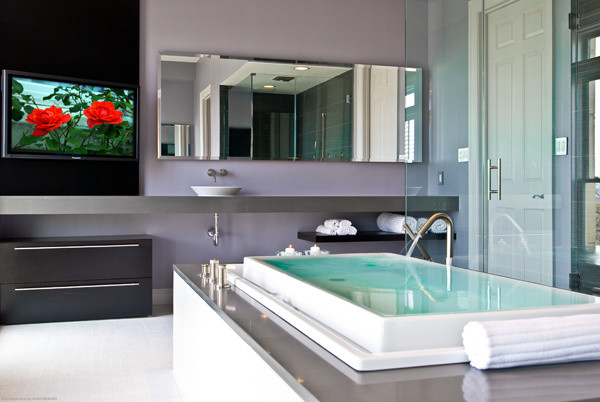 Example of a transitional master freestanding bathtub design in DC Metro with a vessel sink, flat-panel cabinets, black cabinets and gray walls