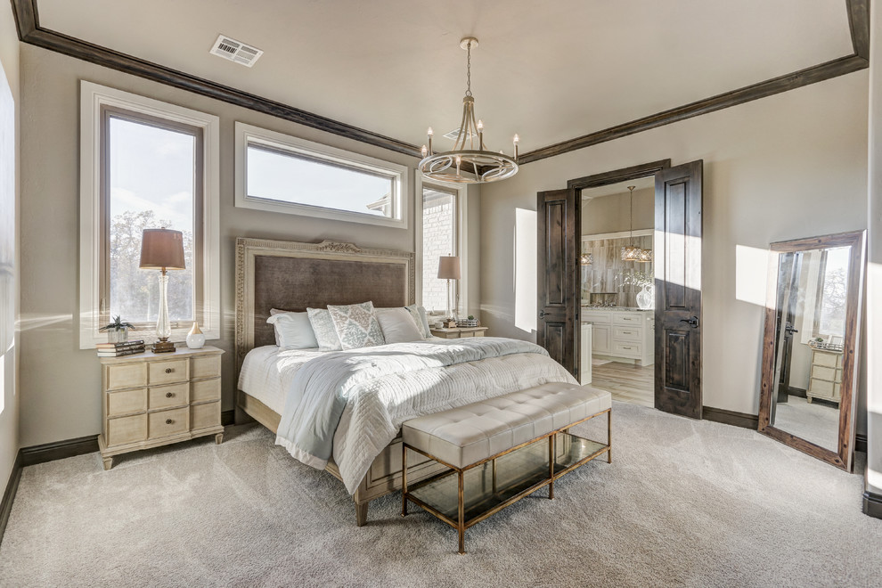 Design ideas for an expansive transitional master bedroom in Oklahoma City with beige walls, carpet and beige floor.