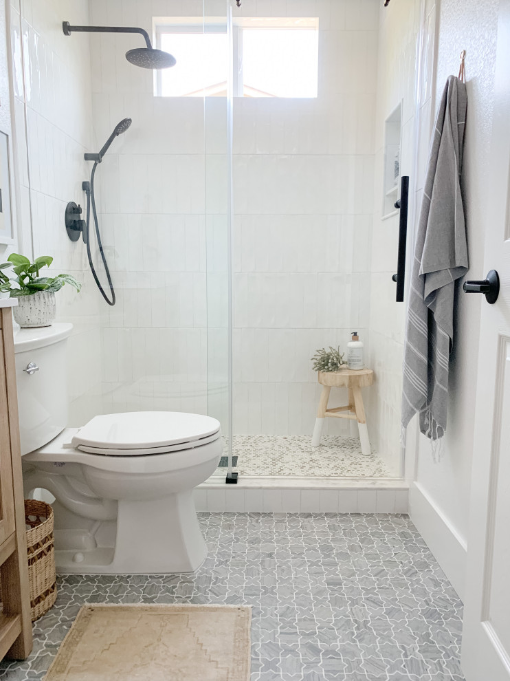 Inspiration for a small transitional bathroom in San Diego with beige cabinets, an alcove shower, white tile, ceramic tile, white walls, marble floors, an undermount sink, engineered quartz benchtops, grey floor, a sliding shower screen, white benchtops, a single vanity and a freestanding vanity.