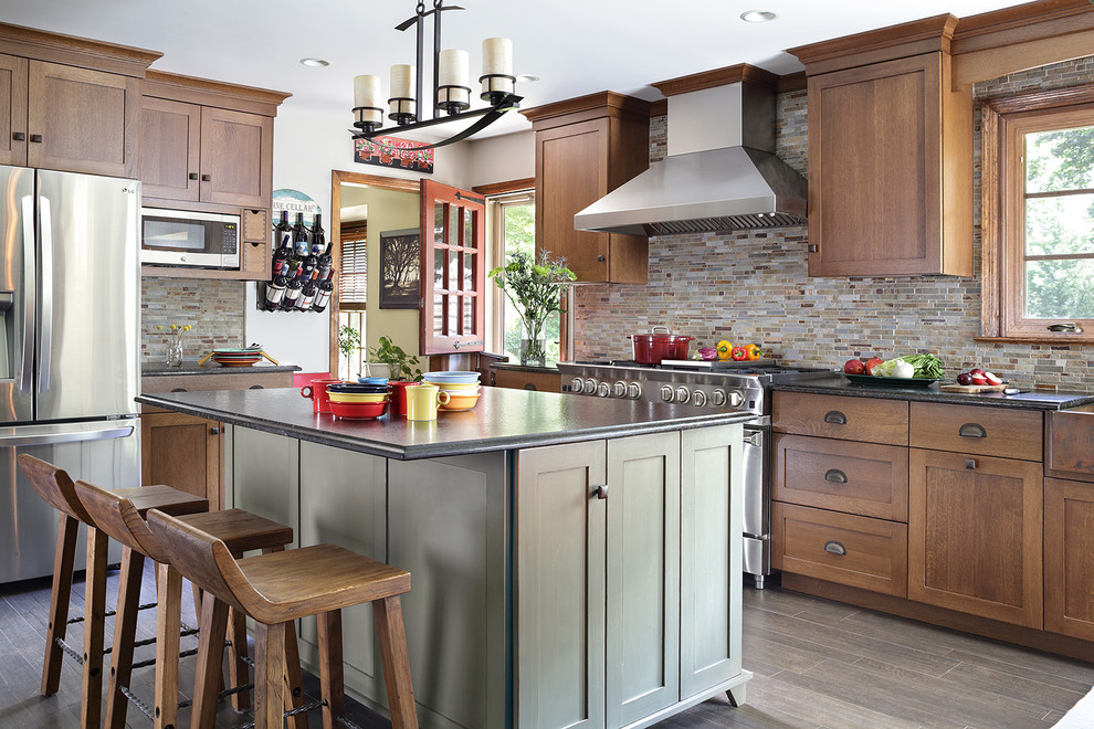 Inspiration for a mid-sized arts and crafts l-shaped separate kitchen in New York with a farmhouse sink, shaker cabinets, light wood cabinets, granite benchtops, grey splashback, stainless steel appliances, dark hardwood floors, with island, matchstick tile splashback and brown floor.