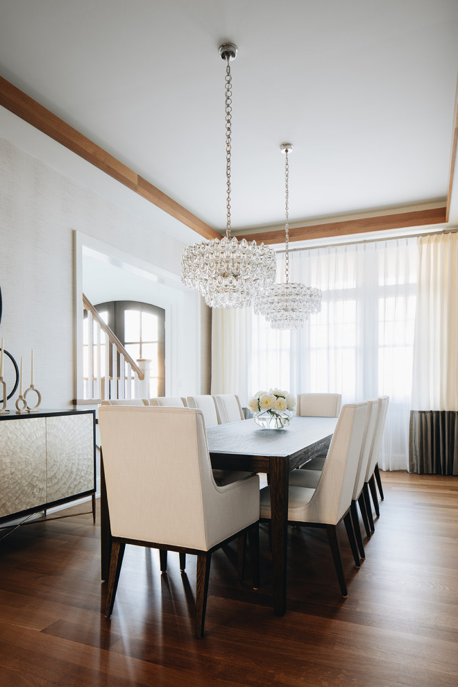 Inspiration for a large traditional enclosed dining room in Chicago with beige walls, light hardwood flooring, brown floors and wallpapered walls.