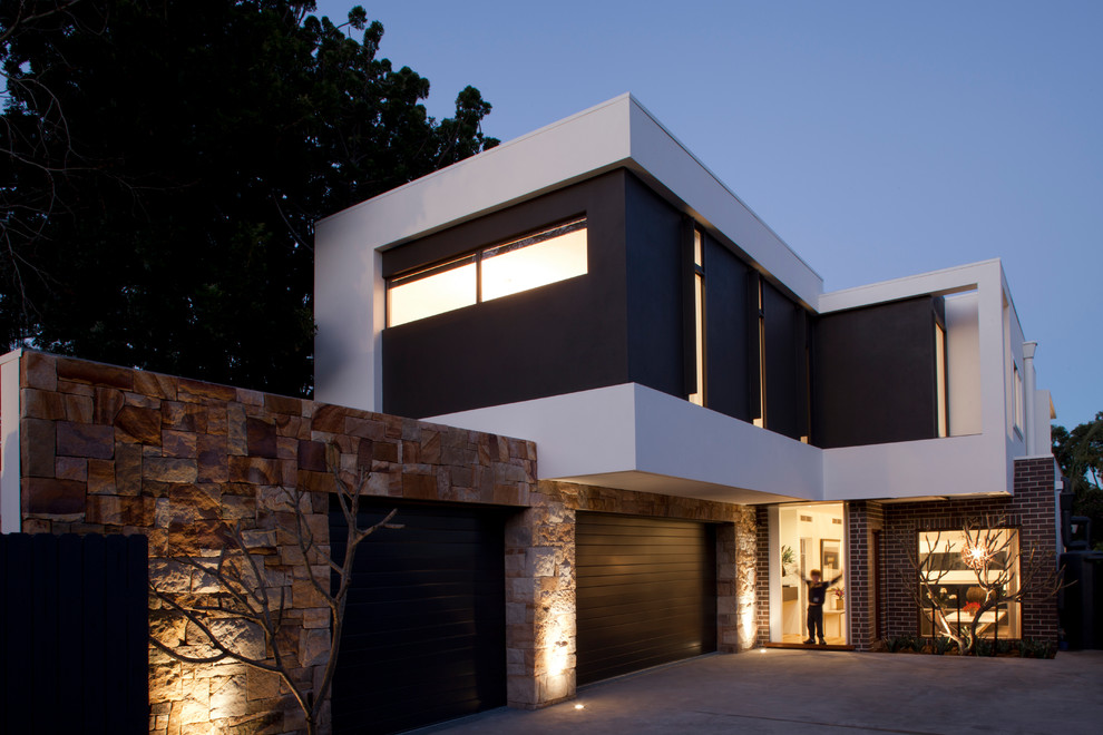 Design ideas for a modern two-storey exterior in Sydney with a flat roof.