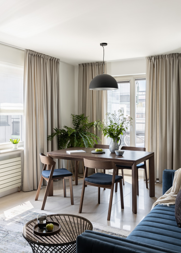 Immagine di un soggiorno design di medie dimensioni con pareti bianche, pavimento in gres porcellanato e pavimento beige