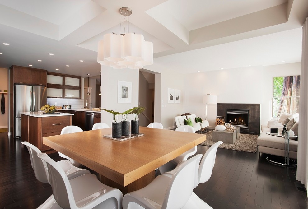Design ideas for a contemporary open plan dining in Edmonton with white walls and dark hardwood floors.
