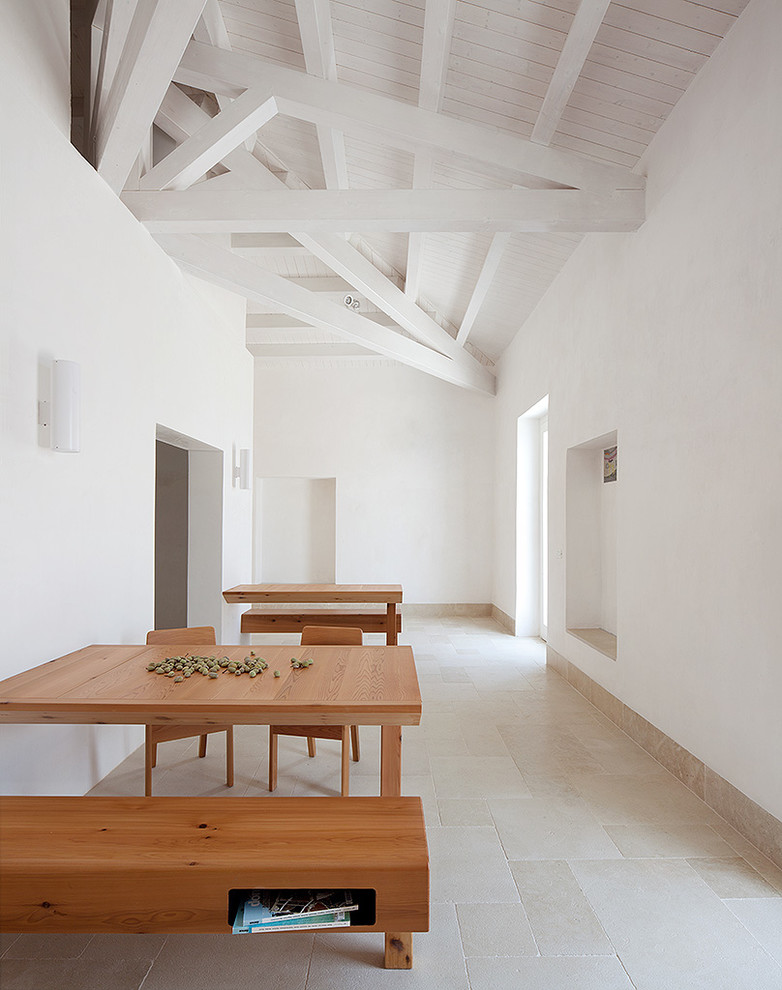 Design ideas for a scandinavian dining room in Catania-Palermo with white walls.