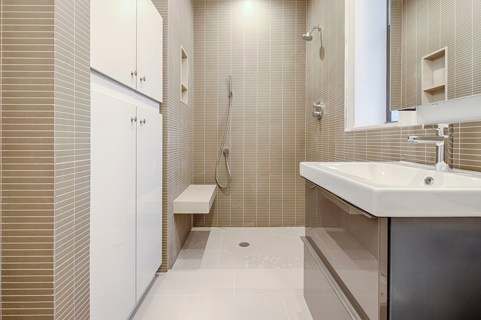 Small contemporary bathroom in New York with flat-panel cabinets and beige cabinets.