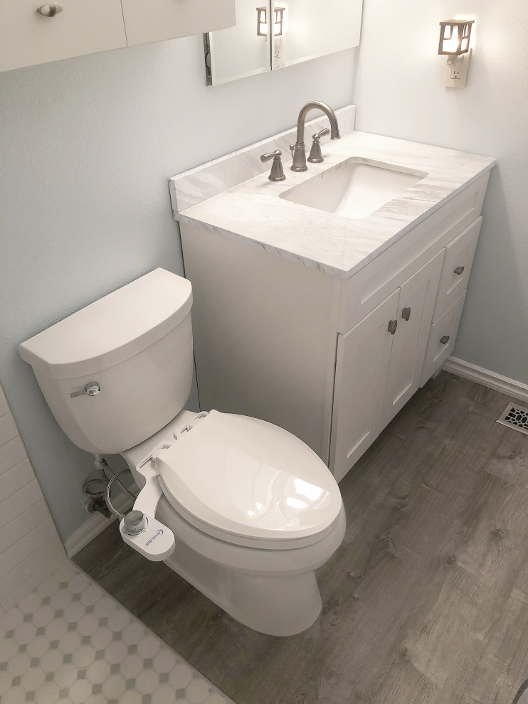 Design ideas for a small traditional master bathroom in Seattle with recessed-panel cabinets, white cabinets, a curbless shower, a bidet, white tile, subway tile, white walls, vinyl floors, an integrated sink, marble benchtops, grey floor, a shower curtain, white benchtops, a niche, a single vanity and a freestanding vanity.