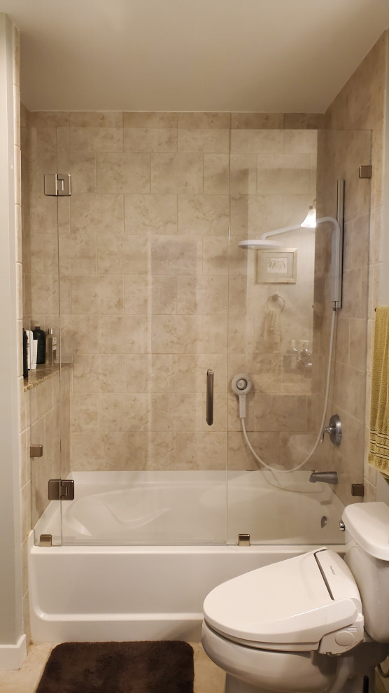 Photo of a small traditional shower room bathroom in Atlanta with an alcove bath, a shower/bath combination, a bidet, beige tiles, porcelain tiles, green walls, porcelain flooring, beige floors, a hinged door and a wall niche.