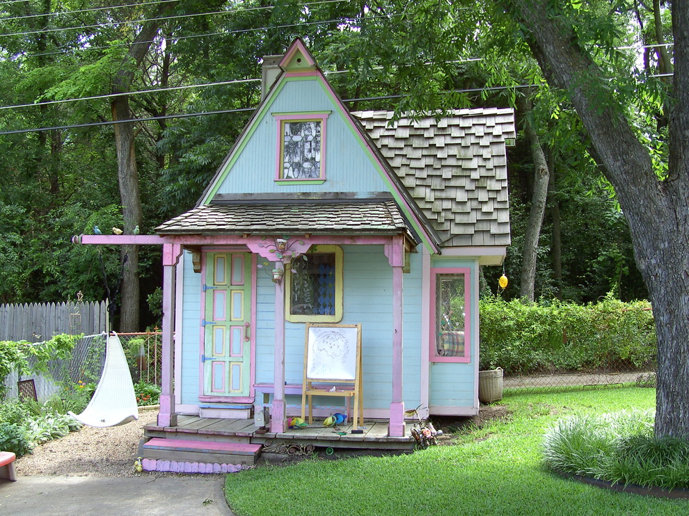 This is an example of a traditional garden in Dallas with with outdoor playset.